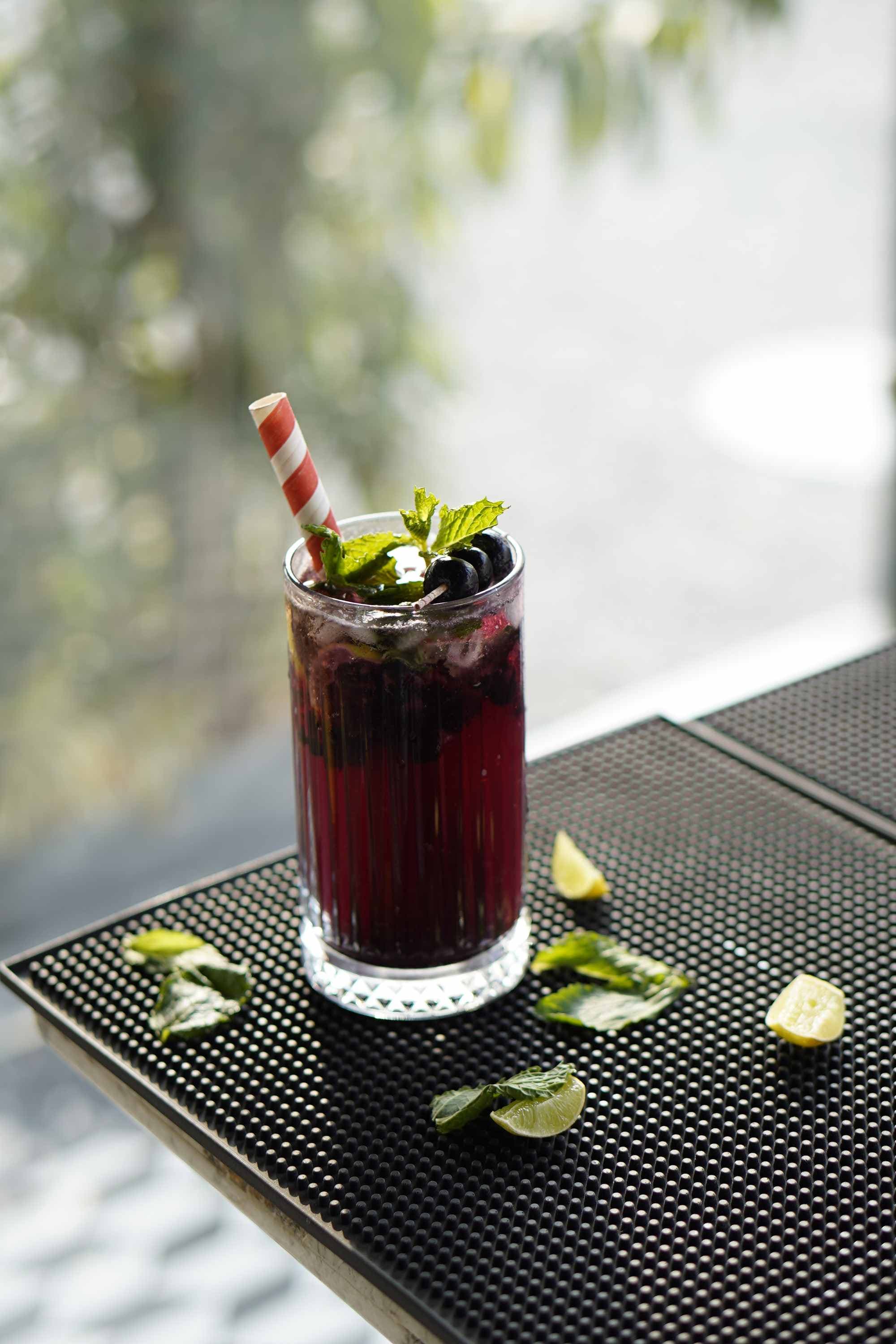 A blackberry mojito on the cafe's outdoor table