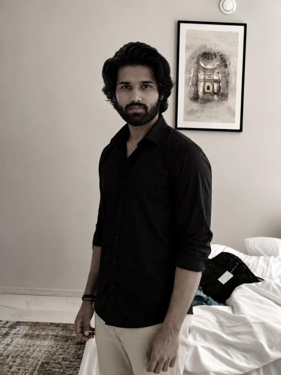 Balram Jaina in a black shirt, in a room lit by daylight