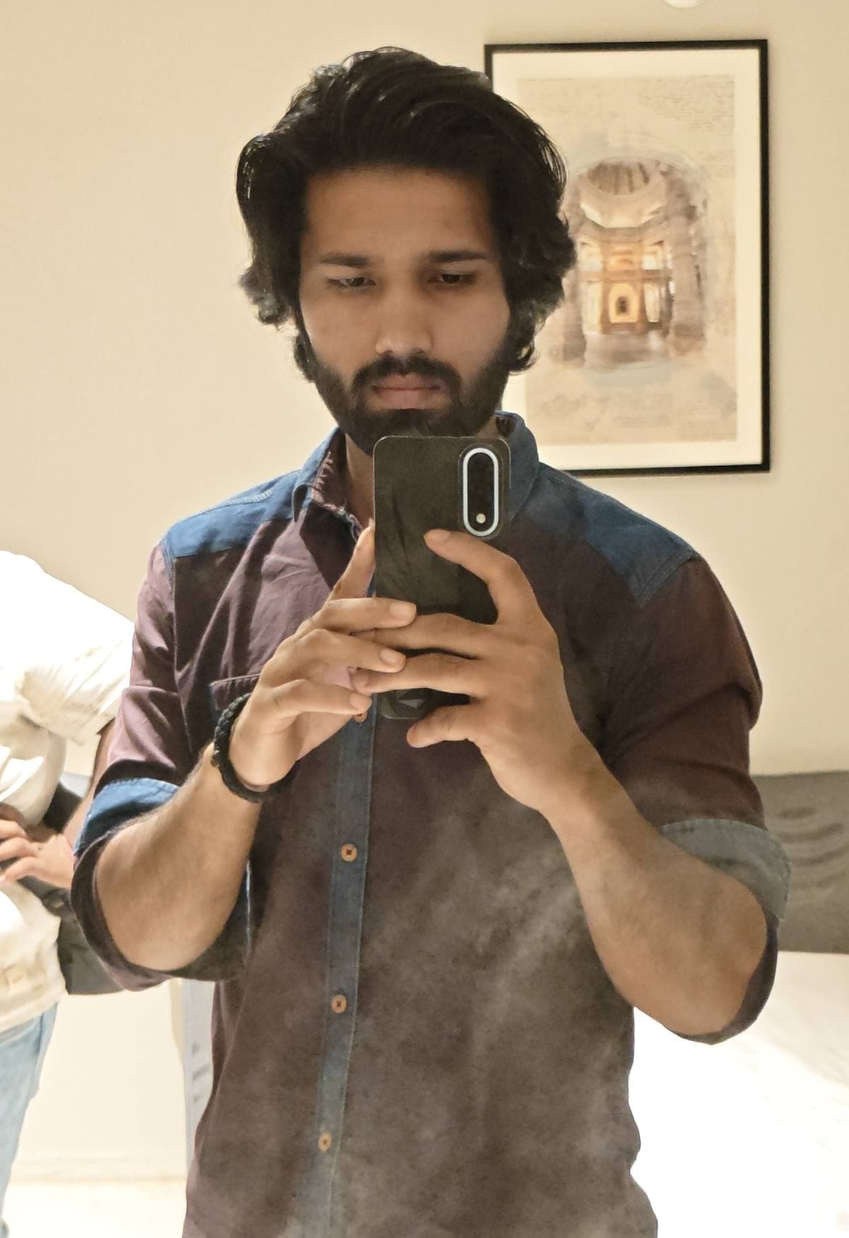 Balram Jaina photographing himself in a mirror