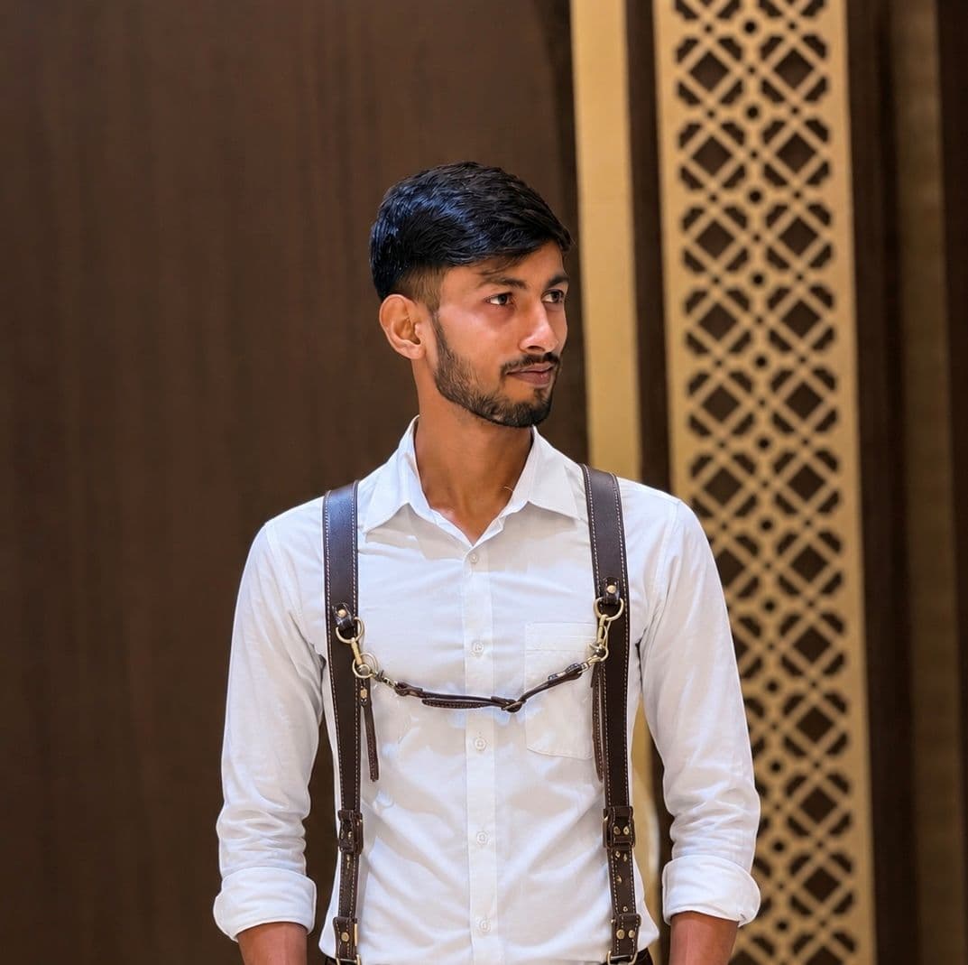 Nikhil Prajapat in a camera harness, looking off frame