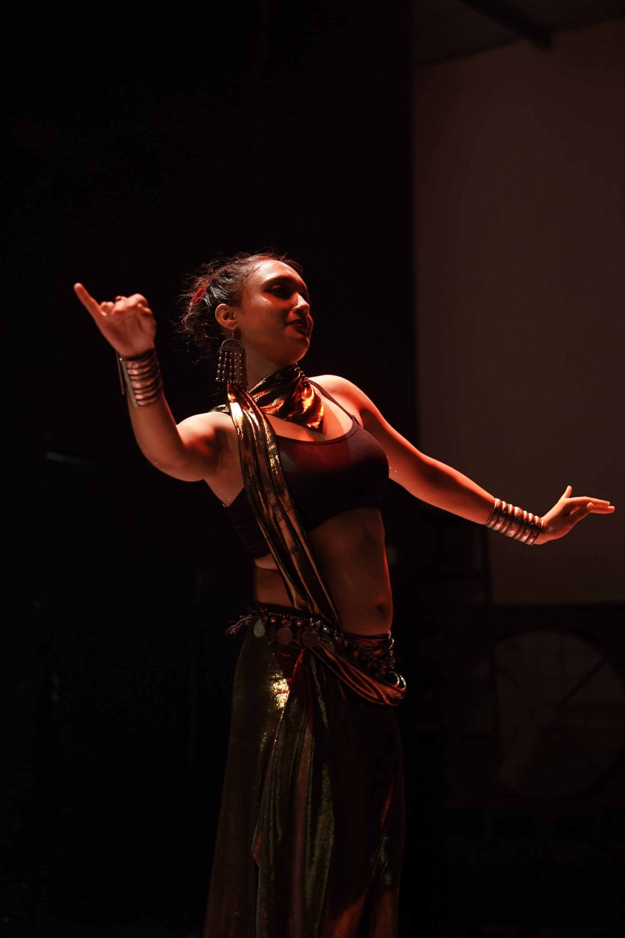 Mid-performance — one light, and the rest of the hall dark